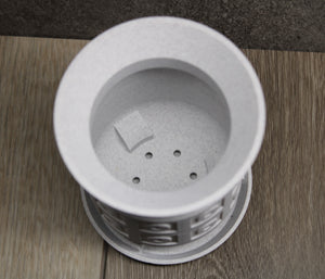 Stone-effect succulent pot with four drain holes